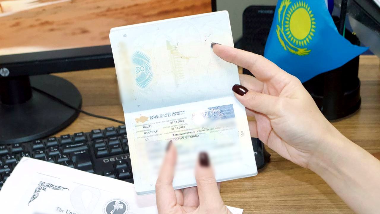 A foreign worker's passport with a Kazakhstan C3 work visa